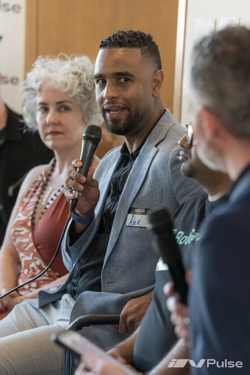 Alex speaking on a panel at an InPulse event